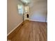 Bedroom features hardwood floors with doorway to bathroom at 2909 Sprucewood Dr, Durham, NC 27707