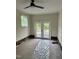 Bonus room with ceiling fan and French doors; carpet covered with plastic at 2909 Sprucewood Dr, Durham, NC 27707