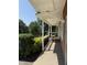 Covered front porch featuring textured flooring and black metal railings at 2909 Sprucewood Dr, Durham, NC 27707