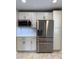 Modern kitchen with stainless appliances and white tile backsplash at 2909 Sprucewood Dr, Durham, NC 27707