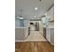Bright kitchen features stainless steel appliances, white cabinetry, and tile floors at 2909 Sprucewood Dr, Durham, NC 27707
