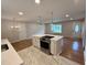 Modern kitchen island with white countertop and stainless steel appliances at 2909 Sprucewood Dr, Durham, NC 27707