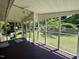 Relaxing screened porch with ceiling fan and views of the landscaped backyard at 2909 Sprucewood Dr, Durham, NC 27707