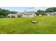 Spacious backyard with lush green grass and mature trees at 3027 Maple # T1, Burlington, NC 27215
