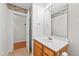 Bathroom vanity with a mirror and floral wallpaper provides a functional and aesthetically pleasing space at 3027 Maple # T1, Burlington, NC 27215