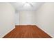 A bright, spacious bedroom with wood floors offers ample space and natural light at 3027 Maple # T1, Burlington, NC 27215