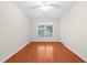 Bright bedroom features wood flooring, ceiling fan and a sunny window at 3027 Maple # T1, Burlington, NC 27215