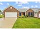 Charming brick home with well-maintained lawn and two-car garage at 3027 Maple # T1, Burlington, NC 27215