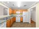 Functional kitchen with wood cabinets, appliances, and plenty of counter space at 3027 Maple # T1, Burlington, NC 27215