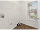 Bright laundry room with shelving and a window, offering convenience and functionality at 3027 Maple # T1, Burlington, NC 27215