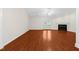 Bright living room with hardwood floors, fireplace, and french doors leading to the backyard at 3027 Maple # T1, Burlington, NC 27215