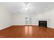 Spacious living room with hardwood floors, a fireplace, and double doors to the exterior at 3027 Maple # T1, Burlington, NC 27215
