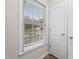 Close-up of a window and door framing neighborhood view, emphasizing natural light and accessibility at 3027 Maple # T1, Burlington, NC 27215