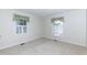 Bright and spacious bedroom with two windows at 303 Spring St, Louisburg, NC 27549