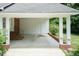 Attached carport offers convenient covered parking and storage space at 303 Spring St, Louisburg, NC 27549