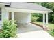 Attached carport offers convenient covered parking and storage space at 303 Spring St, Louisburg, NC 27549
