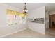 Bright dining room area with view of the kitchen at 303 Spring St, Louisburg, NC 27549