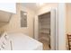 Well-lit laundry room with appliances and open shelving for efficient storage solutions at 303 Spring St, Louisburg, NC 27549