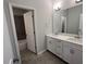 Bright bathroom featuring double sinks, white cabinetry, and a separate door to the toilet and bath area at 3191 Mission Olive Pl # 350, New Hill, NC 27562