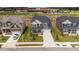 Birds-eye view of a new construction home in a suburban neighborhood with manicured lawns and nearby amenities at 3500 Bailey Lake Dr, Fuquay Varina, NC 27526