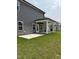 Exterior of home showing a covered porch and concrete patio along with a lush lawn at 3500 Bailey Lake Dr, Fuquay Varina, NC 27526