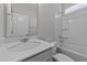 Bathroom featuring a shower-tub combo with tiled walls and modern fixtures at 3500 Bailey Lake Dr, Fuquay Varina, NC 27526