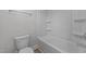 Modern bathroom with a pristine toilet and a tub-shower combination with white finishes at 3500 Bailey Lake Dr, Fuquay Varina, NC 27526