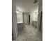 Bathroom featuring a long vanity with double sinks, gray tile floors and modern lighting at 3500 Bailey Lake Dr, Fuquay Varina, NC 27526
