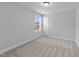Inviting bedroom featuring soft carpet and a window providing natural light and ventilation at 3500 Bailey Lake Dr, Fuquay Varina, NC 27526