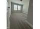 Bright bedroom featuring plush carpeting and a well-lit window at 3500 Bailey Lake Dr, Fuquay Varina, NC 27526