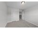 Carpeted bedroom featuring a closet door and a doorway, providing privacy and comfort at 3500 Bailey Lake Dr, Fuquay Varina, NC 27526