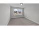 Serene bedroom with soft carpet, a window, and light walls for a comfortable retreat at 3500 Bailey Lake Dr, Fuquay Varina, NC 27526