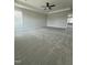 Neutral bedroom featuring plush carpet, ceiling fan and abundant natural light at 3500 Bailey Lake Dr, Fuquay Varina, NC 27526