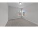 Neutral bedroom with soft carpet and two windows allowing ample natural light at 3500 Bailey Lake Dr, Fuquay Varina, NC 27526