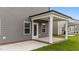A ground-level shot of the covered patio extending to the manicured lawn at 3500 Bailey Lake Dr, Fuquay Varina, NC 27526