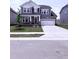Beautiful two-story home with an attached garage, neatly landscaped lawn, and attractive gray siding at 3500 Bailey Lake Dr, Fuquay Varina, NC 27526