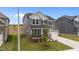 Well-maintained home with gray siding, white trim, two-car garage, and a cozy, landscaped front yard at 3500 Bailey Lake Dr, Fuquay Varina, NC 27526