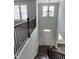 Bright foyer showcasing tall ceilings, hardwood floors, and a staircase with wooden railings at 3500 Bailey Lake Dr, Fuquay Varina, NC 27526