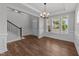 Bright and airy foyer featuring hardwood floors, wainscoting, and stairs at 3500 Bailey Lake Dr, Fuquay Varina, NC 27526
