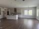 Bright open-concept kitchen with stainless appliances, a granite island, and hardwood floors adjacent to an eating area at 3500 Bailey Lake Dr, Fuquay Varina, NC 27526