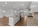 Spacious kitchen features central island, stainless appliances, granite countertops, and hardwood floors at 3500 Bailey Lake Dr, Fuquay Varina, NC 27526