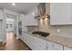 Kitchen with modern appliances, granite countertops, tile backsplash, and hardwood floors at 3500 Bailey Lake Dr, Fuquay Varina, NC 27526