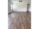 Spacious living room featuring hardwood floors, a ceiling fan, and a neutral color scheme at 3500 Bailey Lake Dr, Fuquay Varina, NC 27526