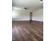 Spacious living room featuring hardwood floors, a ceiling fan, and a neutral color scheme at 3500 Bailey Lake Dr, Fuquay Varina, NC 27526