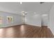 Bright living room with hardwood floors, ceiling fan, and large windows at 3500 Bailey Lake Dr, Fuquay Varina, NC 27526