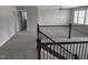 Bright loft with a ceiling fan, carpeted floor, and an elegant railing at 3500 Bailey Lake Dr, Fuquay Varina, NC 27526