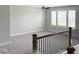 Spacious loft with a ceiling fan, carpeted floor, and plenty of light at 3500 Bailey Lake Dr, Fuquay Varina, NC 27526