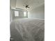 Spacious main bedroom with tray ceilings, ceiling fan, and large windows at 3500 Bailey Lake Dr, Fuquay Varina, NC 27526