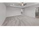 Large main bedroom with a tray ceiling, ceiling fan, and a doorway to the ensuite bathroom at 3500 Bailey Lake Dr, Fuquay Varina, NC 27526