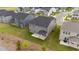 Aerial view of a two-story house with gray siding, a covered patio, and a verdant green lawn at 3500 Bailey Lake Dr, Fuquay Varina, NC 27526